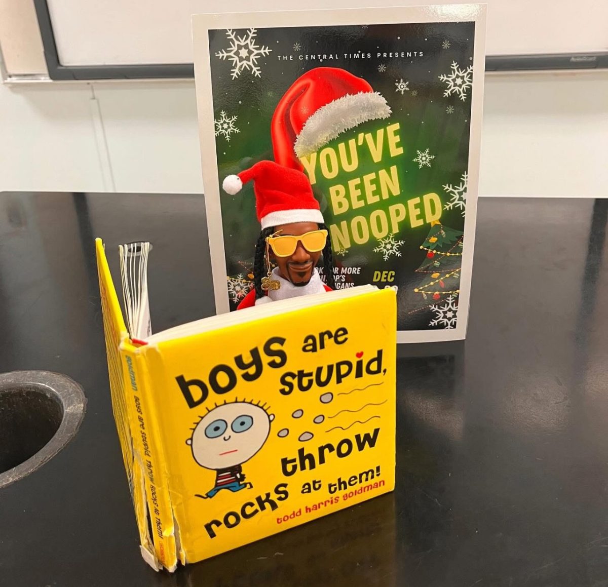 Last year's visit from Snoop to then biology teacher Jared Eaton. Eaton was known for lending his copy of Boys Are Stupid, Throw Rocks at Them to girls in need. 