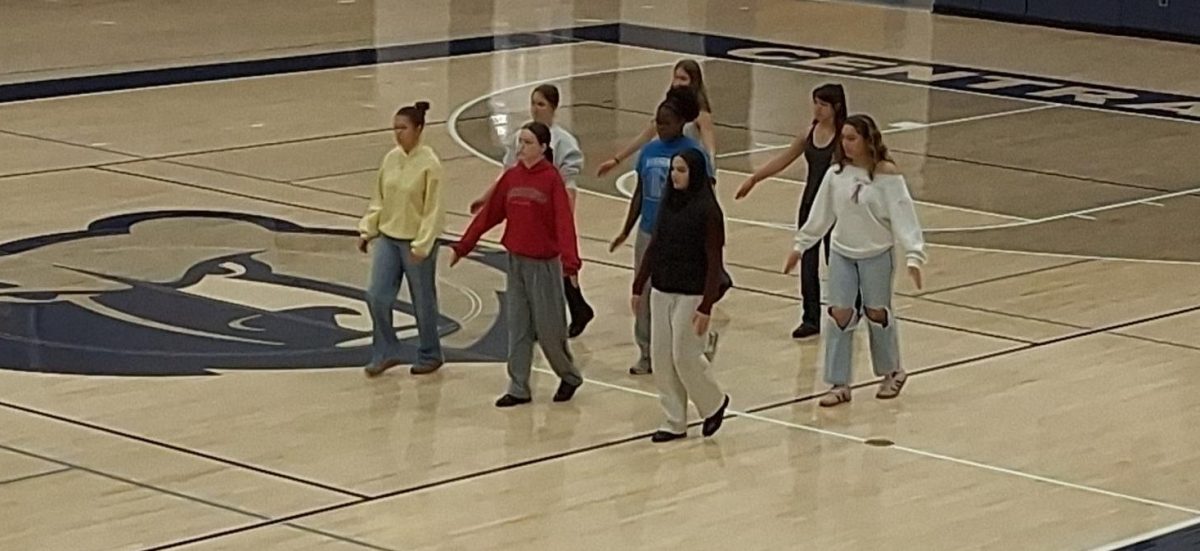 JROTC drill team practicing an exhibition sequence in the big gym on Feb.13