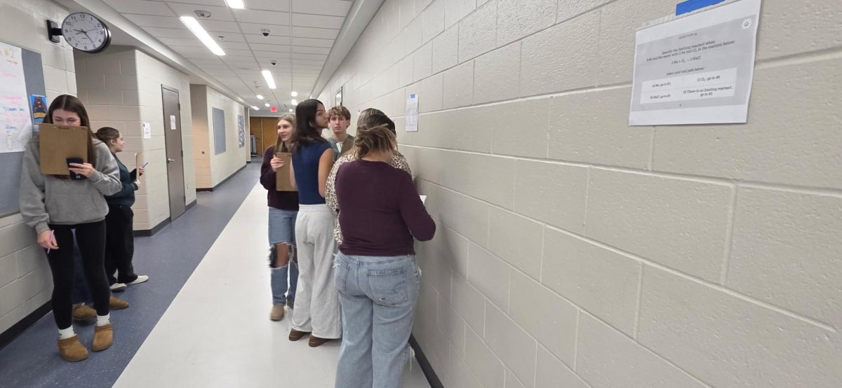 Teachers Jonathan Fairbanks and Leann Blair merge their classes in the hall to do a limiting reaction trail. (Feb. 17)