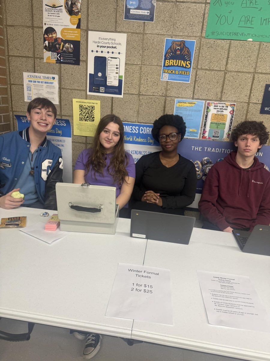 Sophomores Rhett Edlin and Lily Baucum along with juniors Joy Ann Settles and Sean Hoffman selling Winter Formal tickets outside the cafeteria on Feb 10 